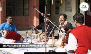 Dr. Manakala Gopalakrishnan performing a Carnatic music rendition at Deepalaya Schools to inspire students in India.